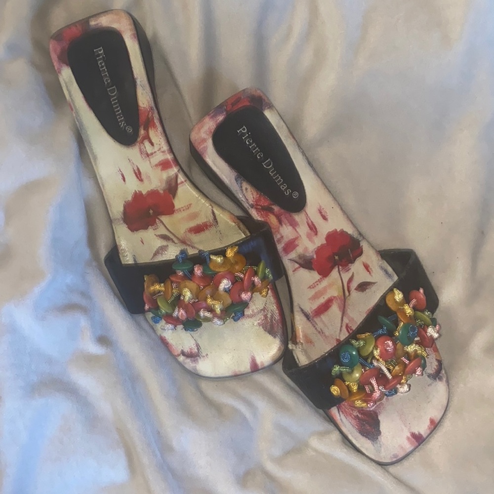 This brand is Pierre Dumas, vintage slides with small wedge